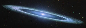 An image of the Sombrero galaxy (Messier 104) taken by the James Webb Space Telescope using the MIRI instrument. The galaxy appears as a smooth, elongated disk with a faintly glowing centre. Surrounding the core is a clumpy outer ring, rich in mid-infrared detail. The background is scattered with galaxies of various shapes and colours, indicating different distances and properties. The galaxy, located in the Virgo constellation, spans roughly 30 million light-years from Earth.